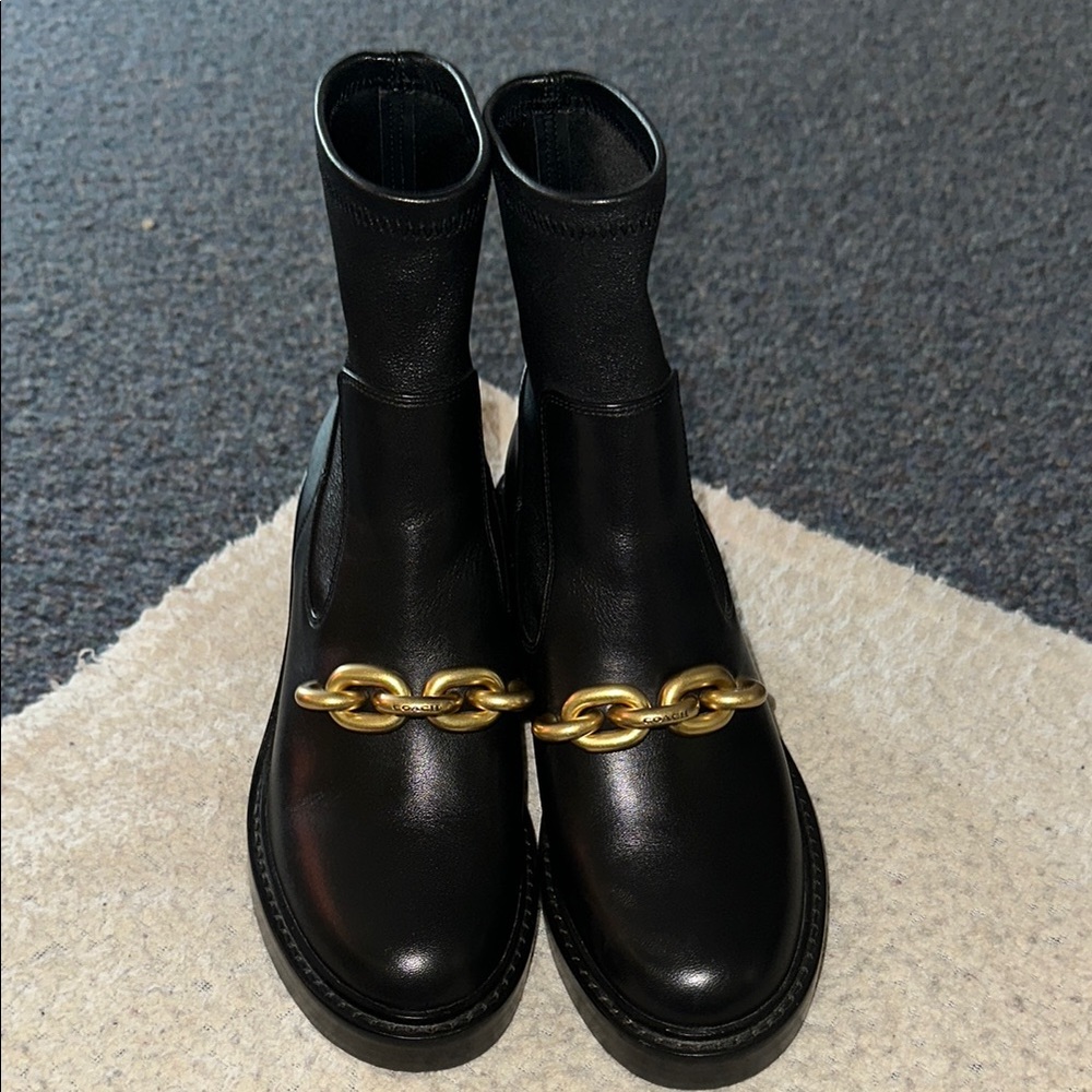 Elegant Black Leather Ankle Boots with Gold Chain